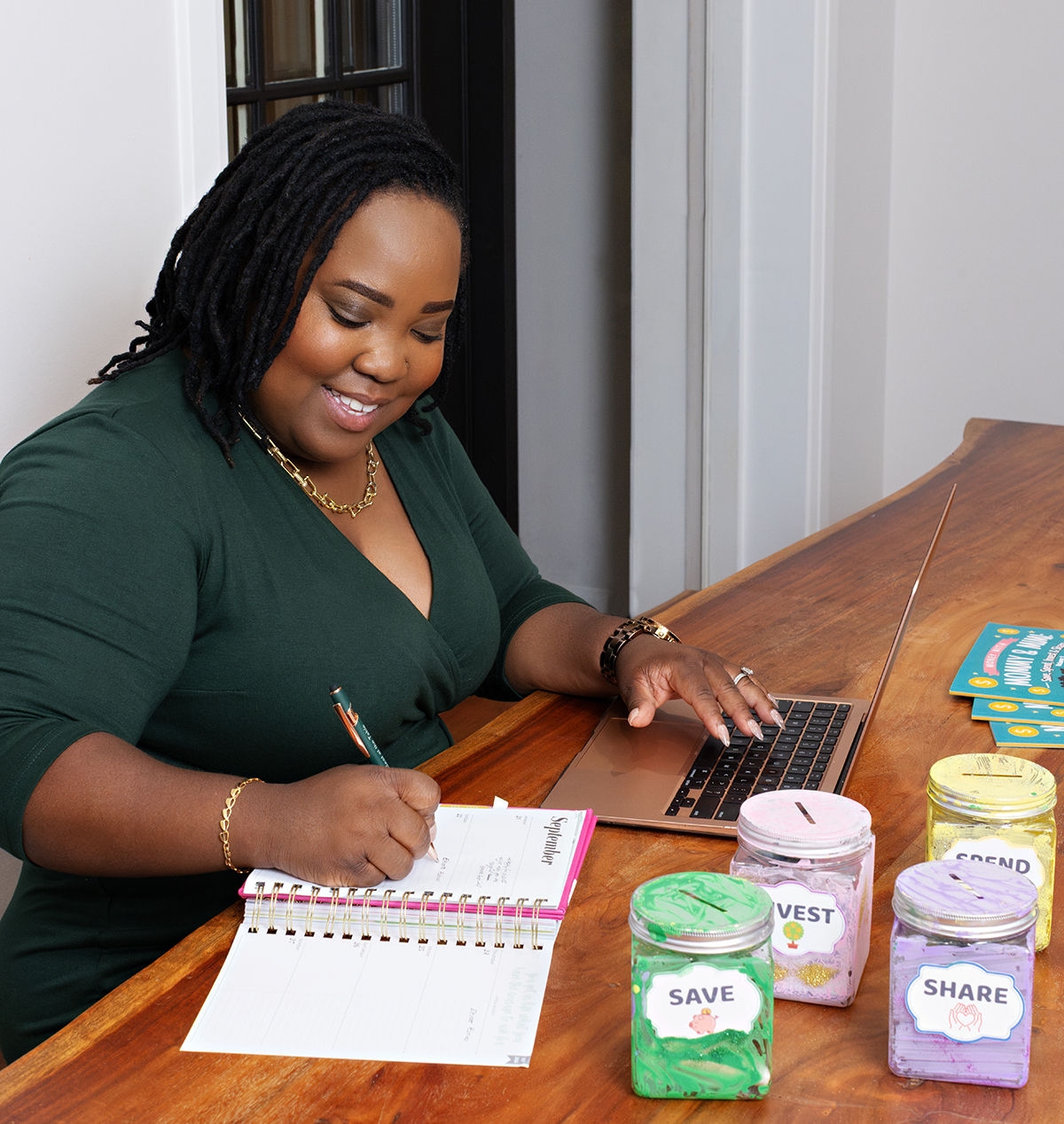 Leah Carr at home with her "four jar" budgeting system. Photo by Jessica Blaine Smith.