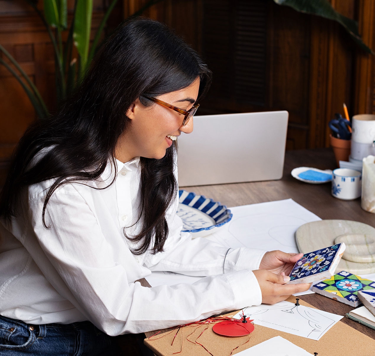 Nairah Awan in her home with samples of Studio Purani's artisan tableware. Photo by Jessica Blaine Smith.