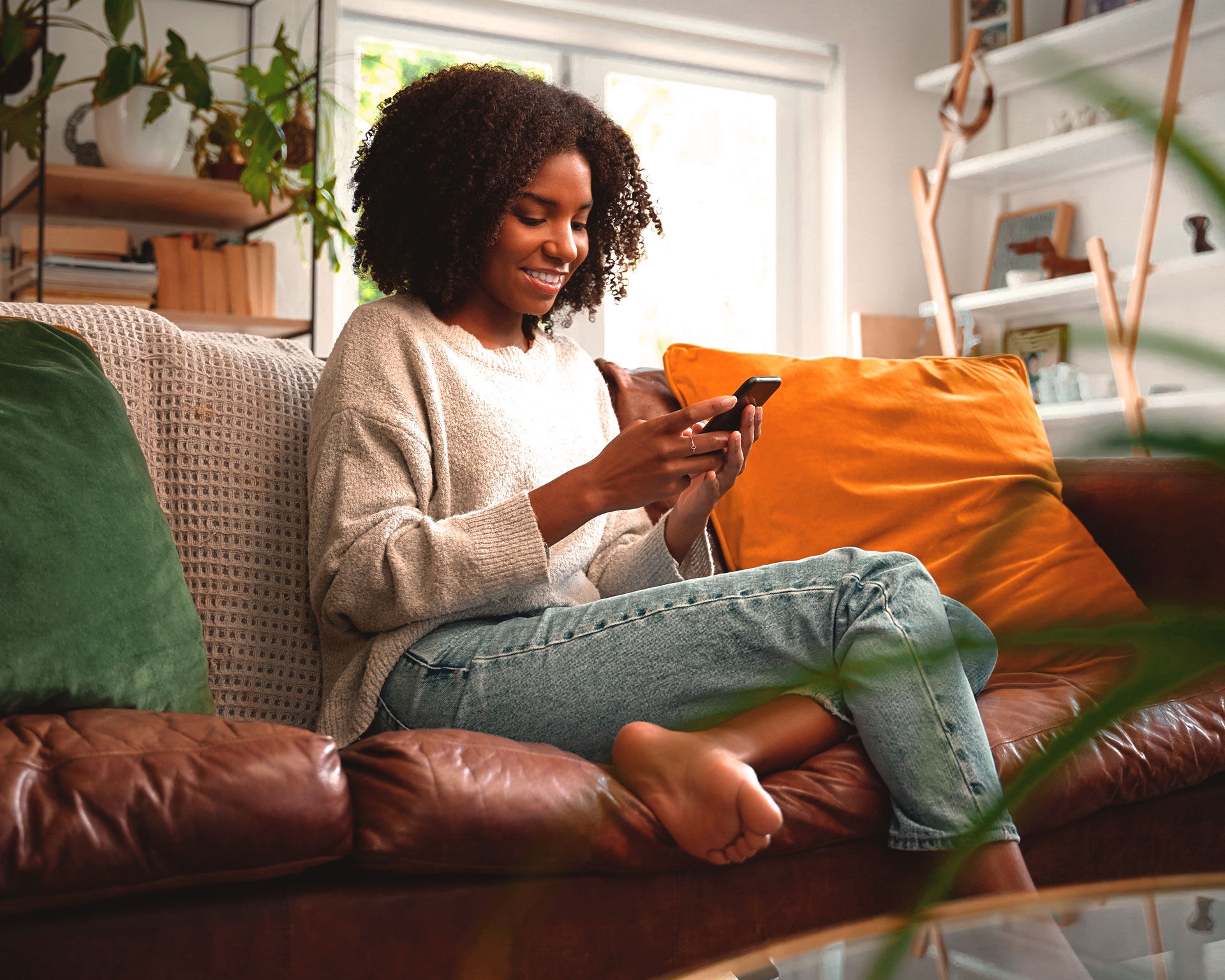 woman sitting phone smiling