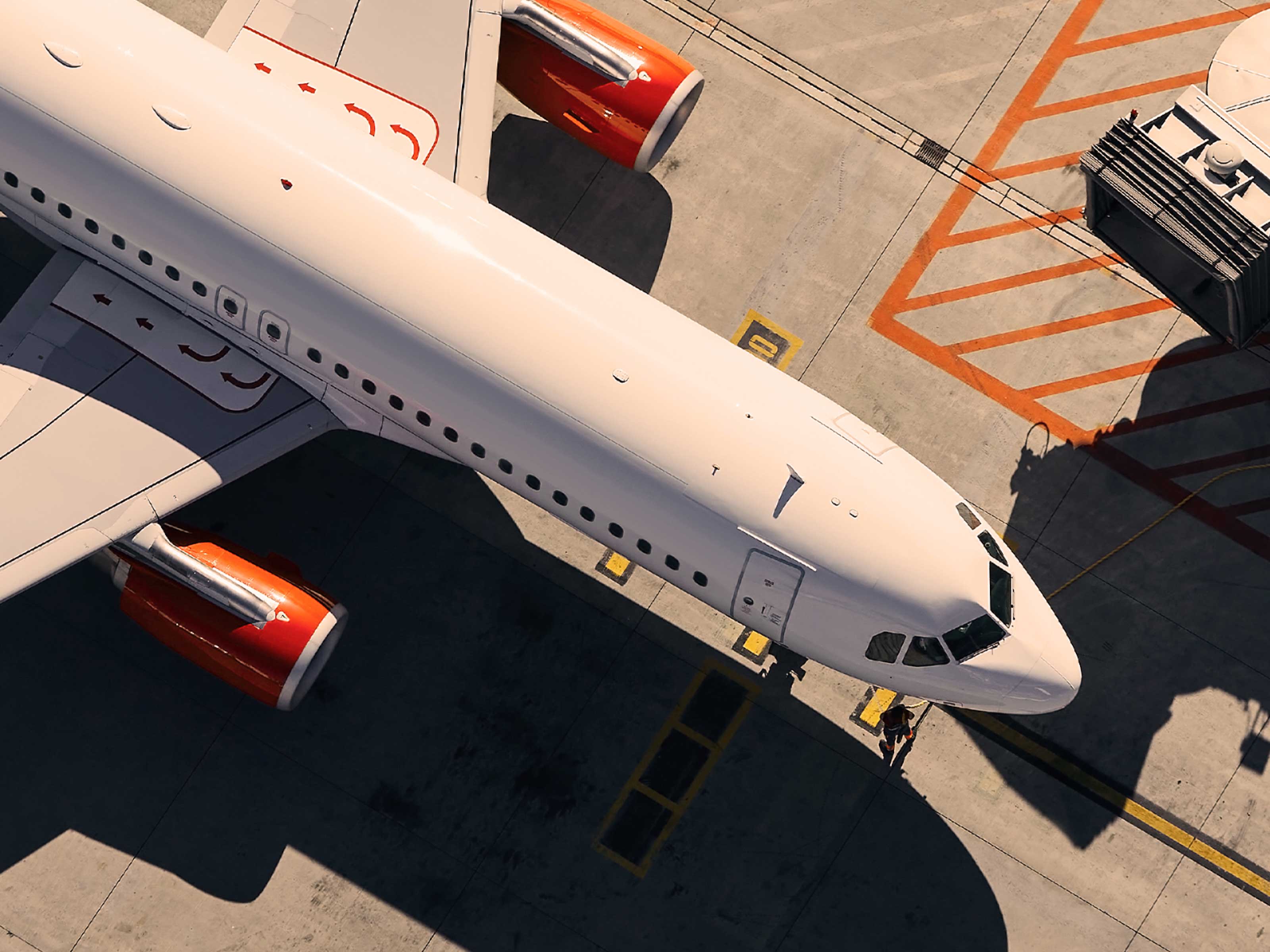 Photo of an airplane on a tarmac viewed from above.