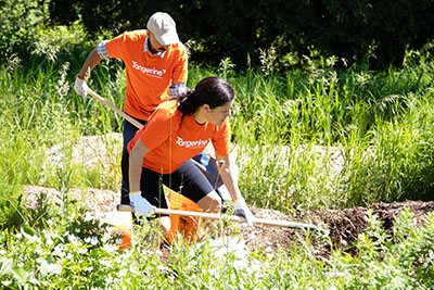 Tangerine's CEO Gillian Riley leading the team for their annual volunteer day at YMCA Cedar Glen